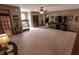 Upstairs living area featuring carpeted floors, a ceiling fan, and natural light at 3819 S Village Dr, New Palestine, IN 46163