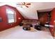 This is an image of the red living room with ample seating and natural light from the arched window at 3819 S Village Dr, New Palestine, IN 46163