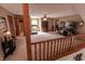 Spacious upstairs living area with treadmill, TV, and view of the entry at 3819 S Village Dr, New Palestine, IN 46163