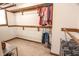 Bright walk-in closet offers lots of storage with adjustable shelving and hanging racks for all your wardrobe needs at 3819 S Village Dr, New Palestine, IN 46163