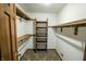 Walk-in closet featuring built-in shelving for organized storage at 3819 S Village Dr, New Palestine, IN 46163