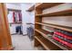 Spacious walk-in closet with ample shelving and hanging space for organized storage solutions at 3819 S Village Dr, New Palestine, IN 46163
