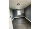 Bedroom featuring a window, light gray walls and wood-look flooring at 409 Parkway Ave, Indianapolis, IN 46225