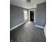 Bedroom featuring a window, light gray walls, wood-look flooring and closet at 409 Parkway Ave, Indianapolis, IN 46225