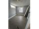 Bedroom with two windows, light gray walls and wood-look flooring at 409 Parkway Ave, Indianapolis, IN 46225