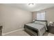 Simple bedroom with neutral colors, a comfortable bed, and natural light from the window at 4167 Apple Creek Dr, Indianapolis, IN 46235