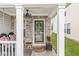 Charming front porch with brick accents, welcoming seating, and stylish decor for a cozy entrance at 4167 Apple Creek Dr, Indianapolis, IN 46235