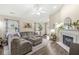 Spacious living room with a fireplace, hardwood floors, and comfortable seating, ideal for Gathering gatherings at 4167 Apple Creek Dr, Indianapolis, IN 46235