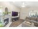 Cozy living room featuring a fireplace, hardwood floors, and comfortable seating, perfect for relaxation at 4167 Apple Creek Dr, Indianapolis, IN 46235