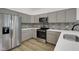 Well-equipped kitchen with stainless steel appliances and stylish backsplash at 4230 Kingsley Dr, Indianapolis, IN 46205