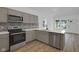 Modern kitchen featuring stainless steel appliances, and stylish countertops at 4230 Kingsley Dr, Indianapolis, IN 46205
