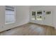 Inviting room featuring new windows, fresh white paint, and modern flooring at 4230 Kingsley Dr, Indianapolis, IN 46205