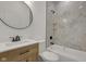 Beautiful bathroom with tiled shower and tub, modern vanity, and elegant mirror at 4234 Kingsley Dr, Indianapolis, IN 46205