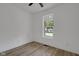 Bright bedroom with a ceiling fan and large window offering natural light and outside views at 4234 Kingsley Dr, Indianapolis, IN 46205