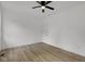Spacious bedroom featuring a ceiling fan, neutral walls and beautiful hardwood floors at 4234 Kingsley Dr, Indianapolis, IN 46205
