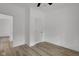 Modern bedroom with a ceiling fan, ample closet space, and hardwood flooring at 4234 Kingsley Dr, Indianapolis, IN 46205