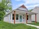 Charming home with a modern farmhouse design with a quaint front porch at 4234 Kingsley Dr, Indianapolis, IN 46205
