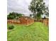 Expansive backyard with lush lawn, enclosed by modern wood fencing, providing privacy and space at 4625 Woodcrest Dr, Columbus, IN 47203
