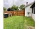 Spacious backyard featuring a well-maintained lawn and privacy fencing, ideal for outdoor activities at 4625 Woodcrest Dr, Columbus, IN 47203