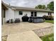 Enjoy this backyard with a hot tub, grill and patio at 4625 Woodcrest Dr, Columbus, IN 47203