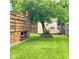 Backyard landscape with modern wood fence and storage shed, offering a blend of functionality and charm at 4625 Woodcrest Dr, Columbus, IN 47203