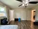 Bright bedroom features wood-look floors and multiple closets, offering ample storage at 4625 Woodcrest Dr, Columbus, IN 47203