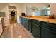 Open-concept kitchen featuring custom cabinets and butcher block countertops at 4625 Woodcrest Dr, Columbus, IN 47203
