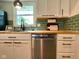 Bright kitchen featuring white cabinets, butcher block countertops, and subway tile at 4625 Woodcrest Dr, Columbus, IN 47203