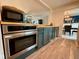 Modern kitchen with stainless steel appliances and ample cabinet space at 4625 Woodcrest Dr, Columbus, IN 47203