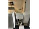Laundry room sink with a black and white tiled floor and a white washing machine at 4625 Woodcrest Dr, Columbus, IN 47203
