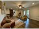 Spacious living room with modern decor and sliding barn door to the kitchen at 4625 Woodcrest Dr, Columbus, IN 47203