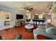 Open floor plan showcasing the living room, dining area, and kitchen with hardwood floors and modern lighting at 4625 Woodcrest Dr, Columbus, IN 47203