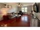 Comfortable living room with wood floors, neutral paint, modern furnishings, and a large window at 4625 Woodcrest Dr, Columbus, IN 47203