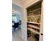 Well-organized pantry with ample shelving provides convenient kitchen storage at 4625 Woodcrest Dr, Columbus, IN 47203
