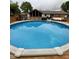 Sparkling in-ground pool with wooden deck, and plenty of space to relax at 4625 Woodcrest Dr, Columbus, IN 47203