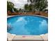 Inviting in-ground pool perfect for hot summer days, surrounded by wooden fencing at 4625 Woodcrest Dr, Columbus, IN 47203