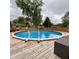 Enjoy the inviting in-ground pool with wooden surround at 4625 Woodcrest Dr, Columbus, IN 47203