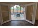 Relax in the sunroom with vaulted ceilings and views of the pool at 4625 Woodcrest Dr, Columbus, IN 47203