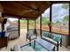 Bright sunroom with modern furniture and backyard views at 4625 Woodcrest Dr, Columbus, IN 47203
