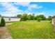 Expansive backyard with a white picket fence and a detached garage at 4640 Autumn Ridge Dr, Columbus, IN 47203