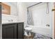 Clean bathroom featuring a shower-tub combo, sleek vanity, and a large, well-lit mirror at 4640 Autumn Ridge Dr, Columbus, IN 47203