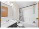 Clean bathroom featuring a shower-tub combo, sleek vanity, and a large, well-lit mirror at 4640 Autumn Ridge Dr, Columbus, IN 47203