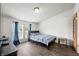 Well-lit bedroom with window, hardwood flooring, and neutral colored walls at 4640 Autumn Ridge Dr, Columbus, IN 47203