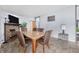 Comfortable dining room with fireplace, stone hearth, and tile flooring at 4640 Autumn Ridge Dr, Columbus, IN 47203