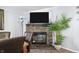 Dining room with stone fireplace, flat screen television, and an indoor plant at 4640 Autumn Ridge Dr, Columbus, IN 47203