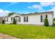 Charming single-story home with a well-manicured lawn and classic white siding at 4640 Autumn Ridge Dr, Columbus, IN 47203