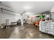 Spacious garage providing ample storage with laundry and utility sink, plus a convenient rolling cart at 4640 Autumn Ridge Dr, Columbus, IN 47203