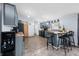 Eat-in kitchen with stainless steel appliances, gray cabinets and bar stool seating at 4640 Autumn Ridge Dr, Columbus, IN 47203