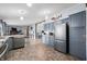 Bright kitchen showcasing stainless steel appliances, cabinetry, and vinyl flooring at 4640 Autumn Ridge Dr, Columbus, IN 47203