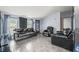 Comfortable living room featuring tile floors and comfortable black leather furniture at 4640 Autumn Ridge Dr, Columbus, IN 47203